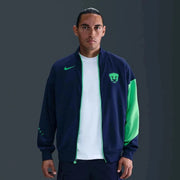 Nike 2025-26 Pumas Men's Academy Pro Anthem Jacket Blue Void/Green Shock/Green Shock (Model - Front)