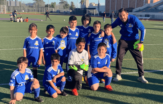 Jewel City FC kids soccer team photo on the pitch with adidas blue/white jerseys