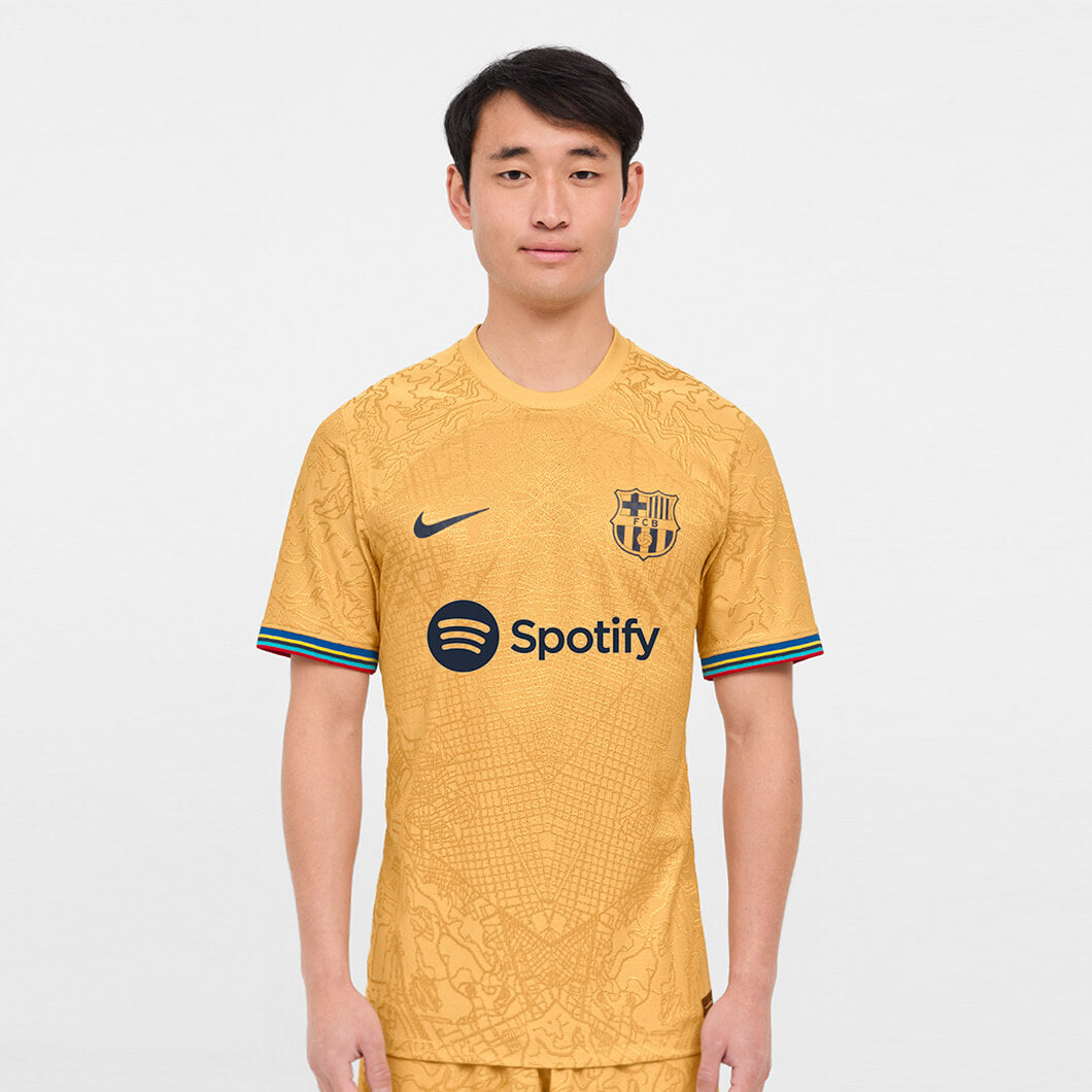 Nike 2022-23 FC Barcelona Authentic Away Jersey - Club Gold-Obsidian (Model - Front)