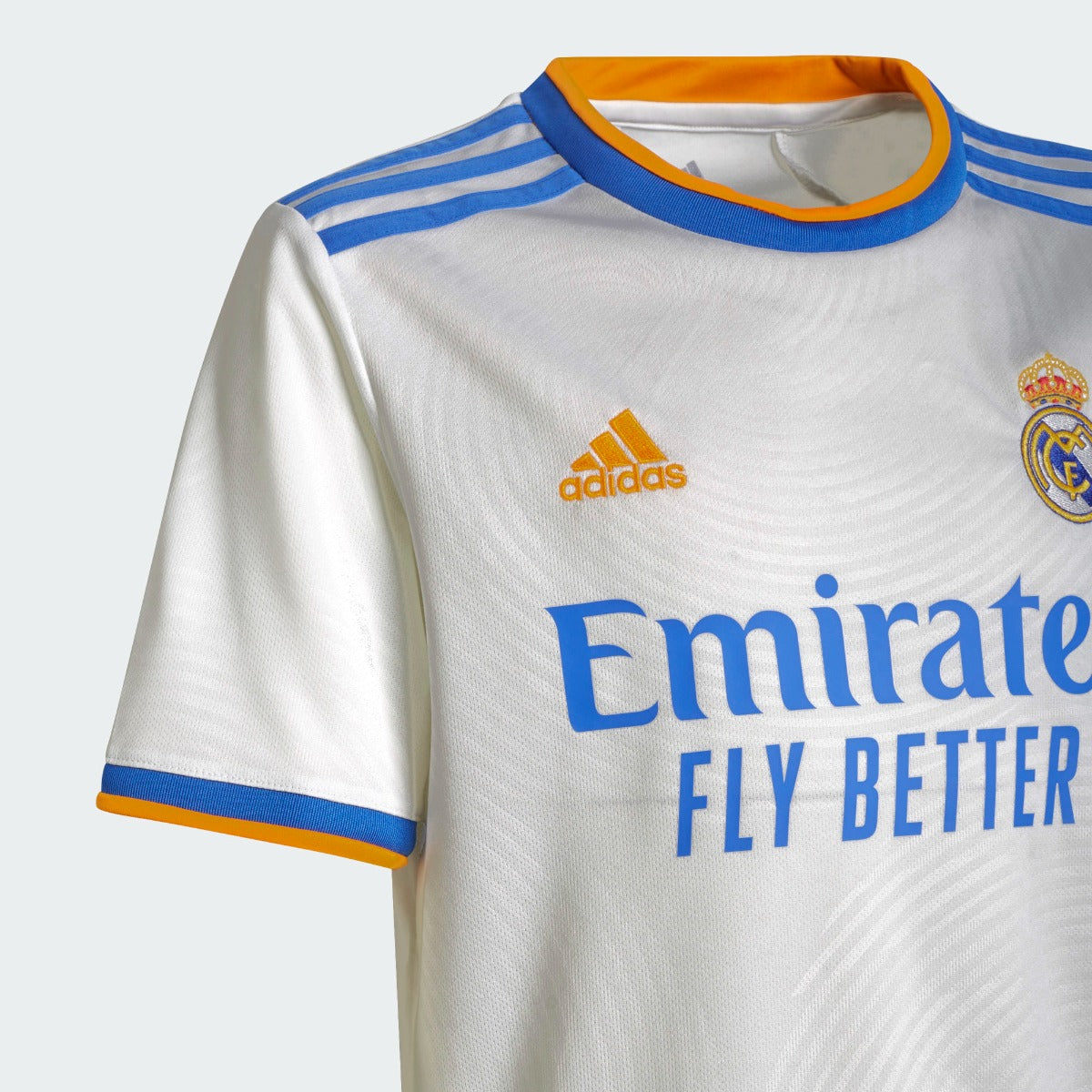 Adidas 2021-22 Real Madrid Youth Home Jersey - White-Blue-Orange (Detail 1)