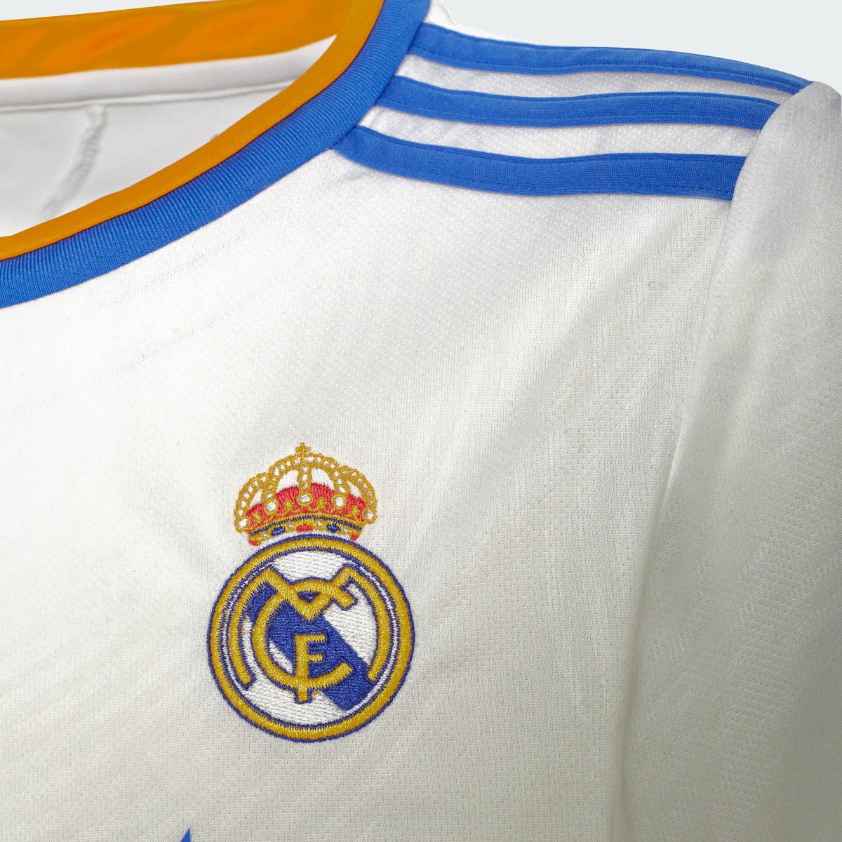 Adidas 2021-22 Real Madrid Youth Home Jersey - White-Blue-Orange (Detail 2)